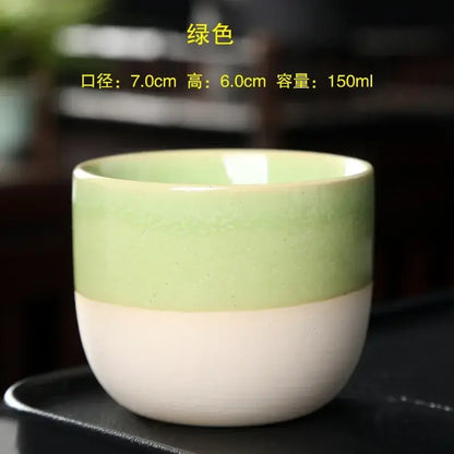 A smooth two-toned handcrafted ceramic kung fu tea cup in mint green and white from decorbites ceramic kung set