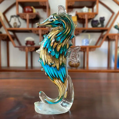 A vibrant hand blown glass sika deer figurine with turquoise and gold patterns for living room decor