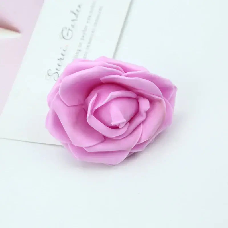 A soft pink handmade foam rose with layered delicate petals for wedding decor and bedroom bouquet by decorbites foam roses