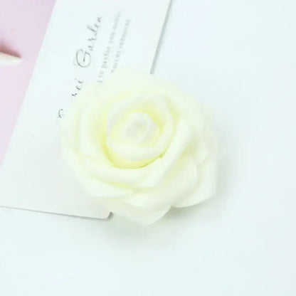 A delicate ivory decorbites foam rose with soft layered petals for a realistic foam roses flower wedding decor bouquet