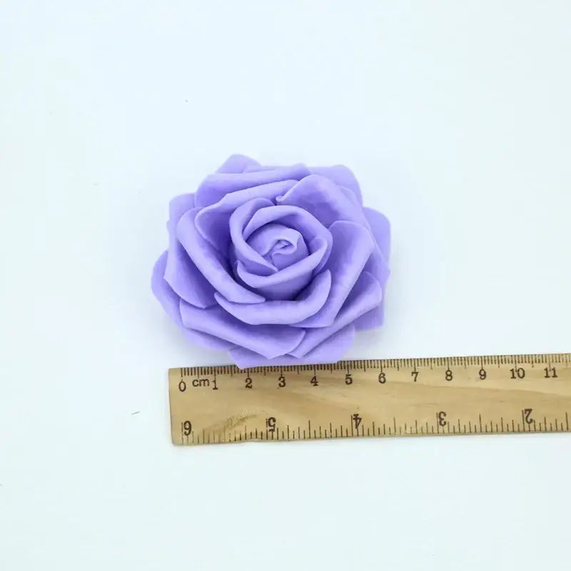 A soft lavender handmade decorbites foam rose with layered petal folds for wedding decor and bedroom bouquet