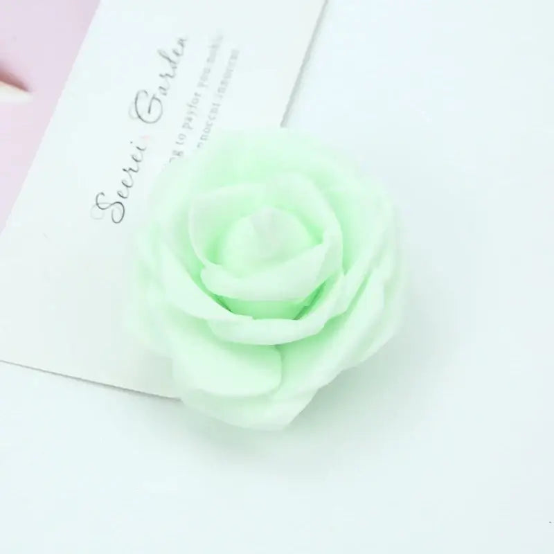 A delicate mint green decorbites foam rose with layered petals for handmade colorful foam roses flower wedding decor