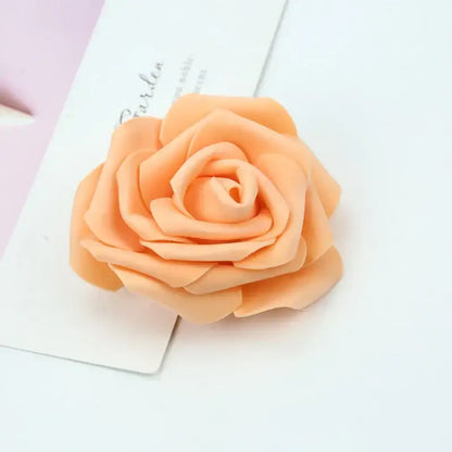 A peach-colored foam roses flower hair clip with layered soft petals and smooth glossy finish for decorbites foam roses decor