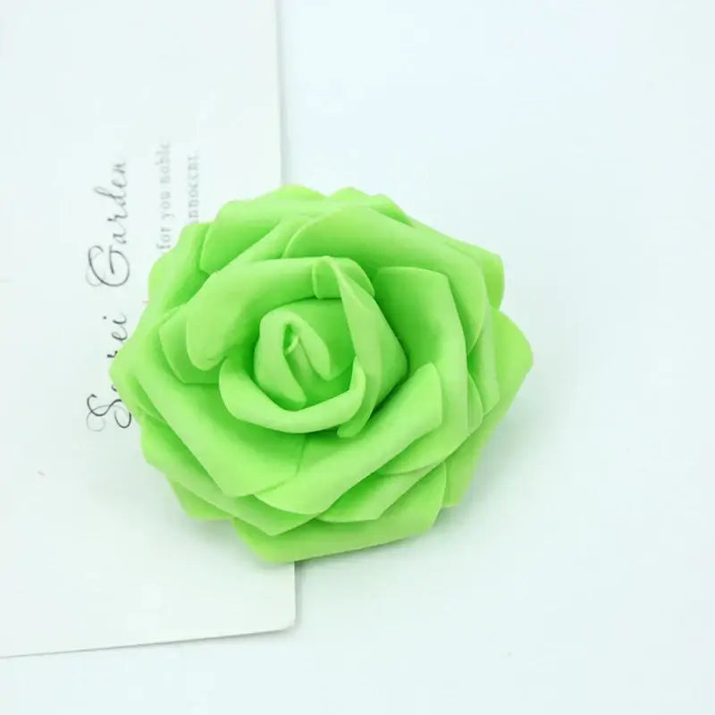 A vibrant lime green handmade foam roses flower with layered petal folds for wedding decor by decorbites foam roses