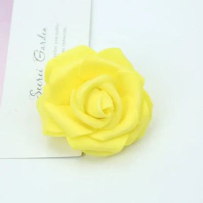 A vibrant yellow handmade decorbites foam rose with soft layered petals for wedding decor and bedroom bouquet