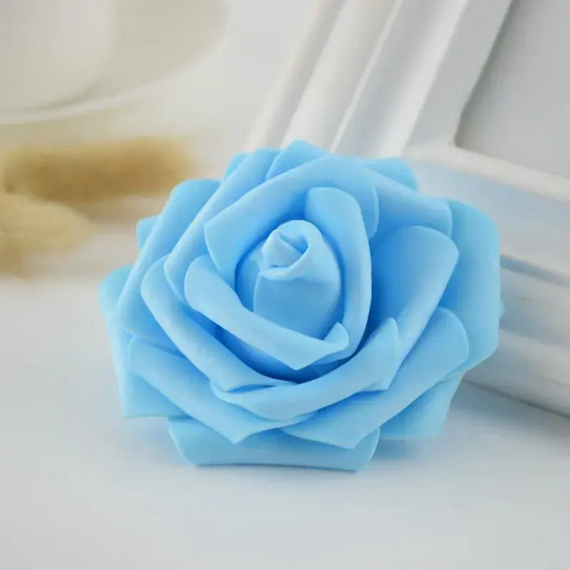 A delicate light blue handmade foam rose with soft layered petals for decorbites foam roses wedding decor