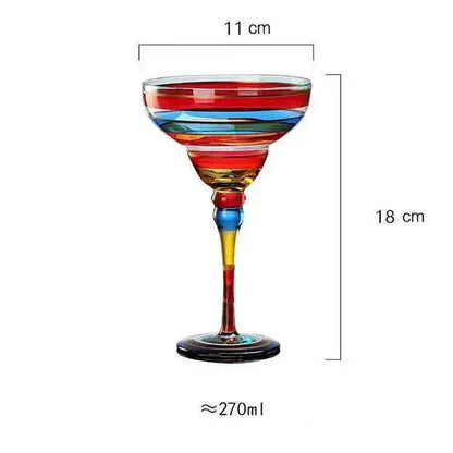 A decorbites handmade colorful margarita coupe glass with swirling red blue and yellow stripes for drinkware decor
