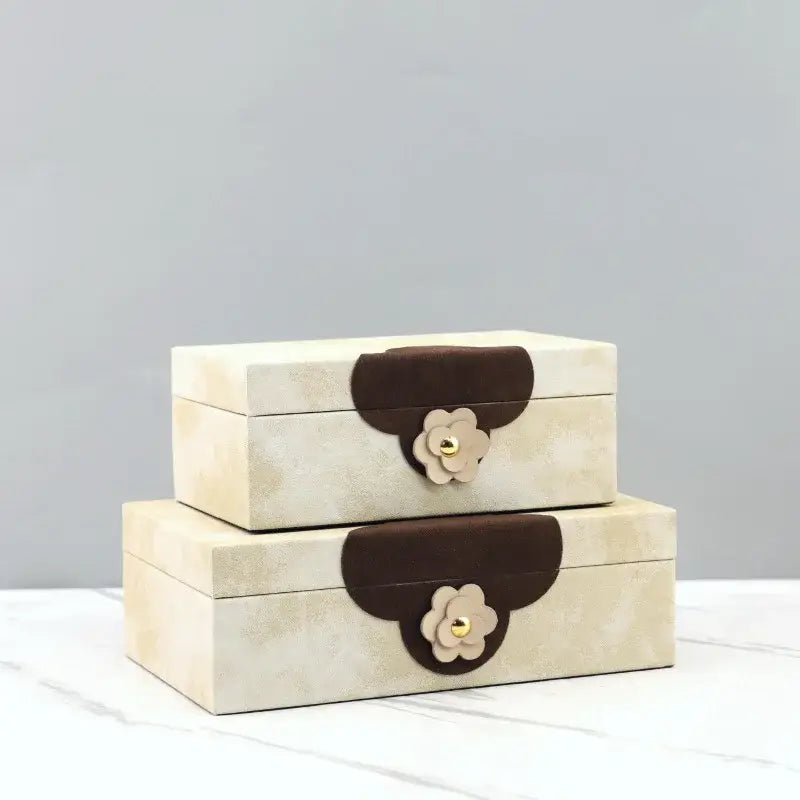 Handmade floral cream and brown leather jewelry box with textured design and decorative flower closures for home decor by decorbites