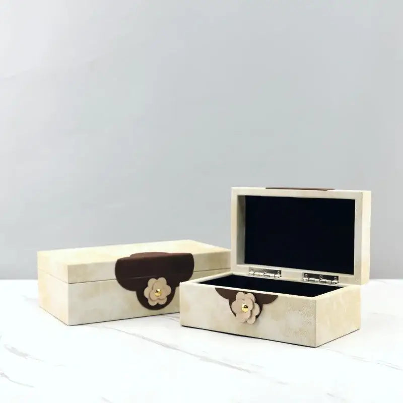 Cream-colored textured wooden jewelry box with brown leather flap and floral clasp for home decor by decorbites handmade flowers