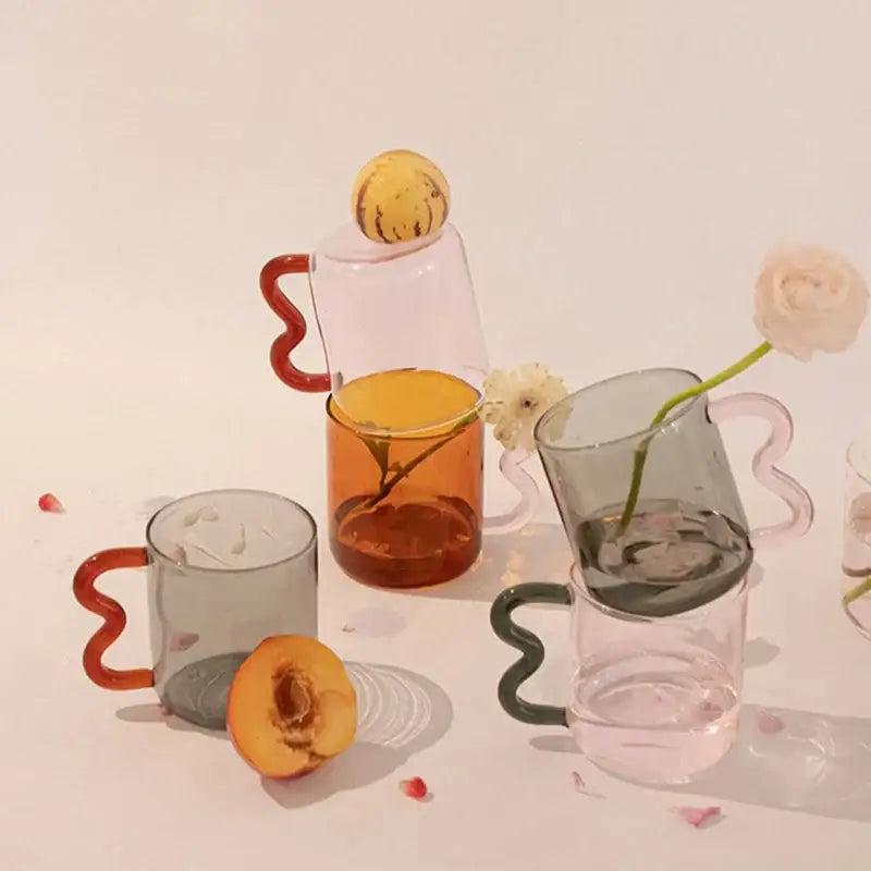 Set of decorbites handmade glass mugs with wavy handles in amber grey and translucent pink for kitchen coffee use