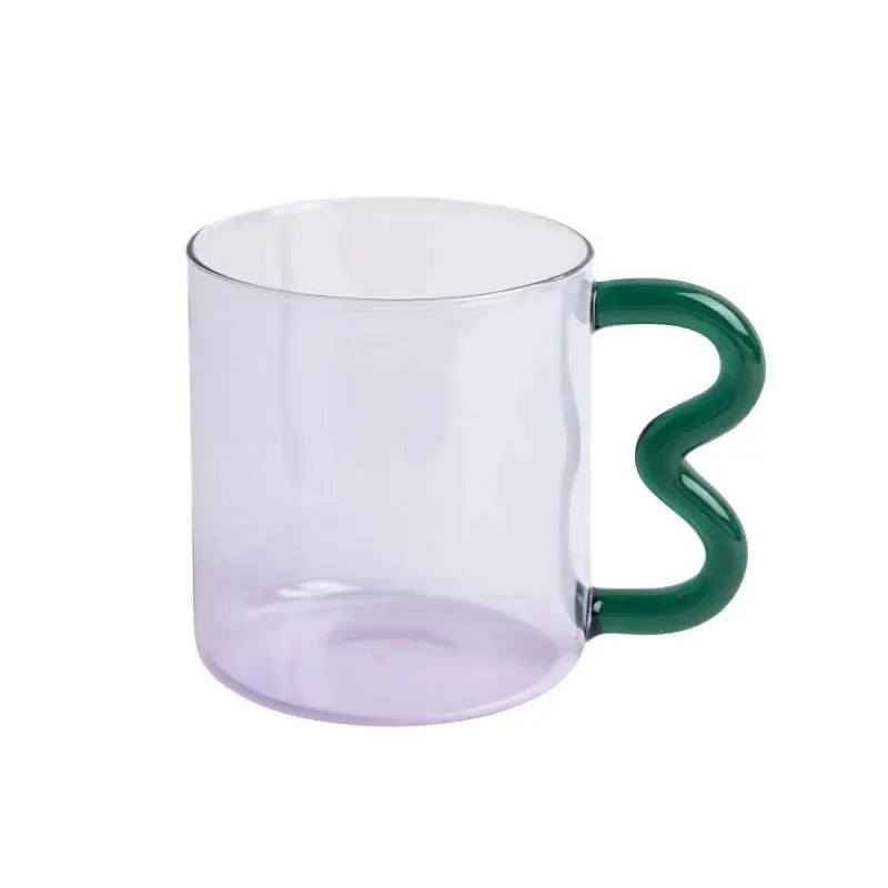 Handmade glass mug from decorbites featuring a translucent lavender body and a glossy wavy green handle for coffee