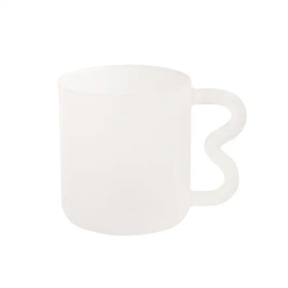 Handmade glass mug with a translucent white frosted body and wavy handle by decorbites for kitchen coffee use