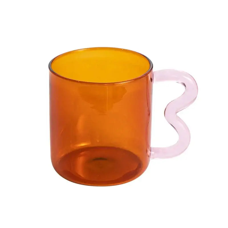 Handmade glass mug by decorbites with transparent amber body and wavy translucent pink handle for kitchen use