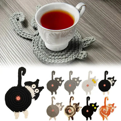 Handmade gray crocheted cat butt coaster with white ceramic teacup resting on it by decorbites cat butt set of 4