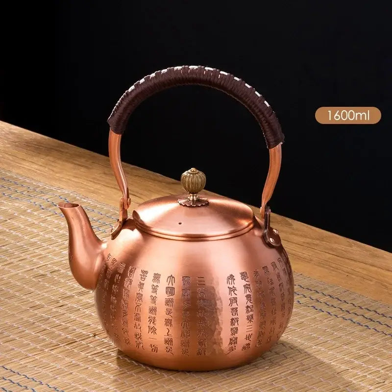 Handmade hammered copper tea pot with knitting handle dark brown woven grip and engraved chinese text decorbites handmade copper