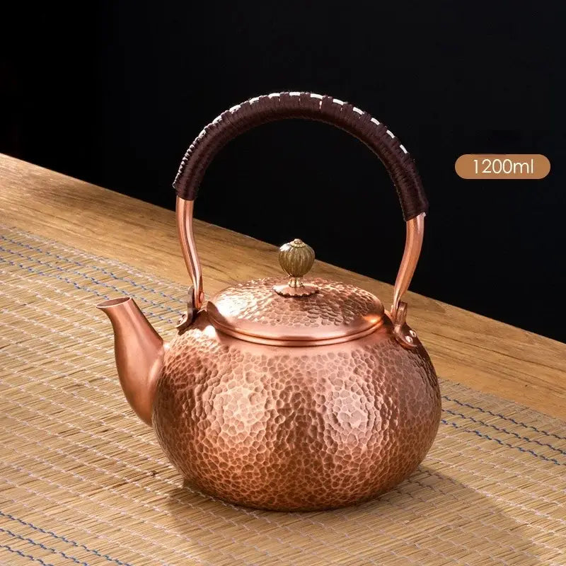 Handmade hammered copper tea pot with dark brown knitting handle and golden lid knob by decorbites handmade copper