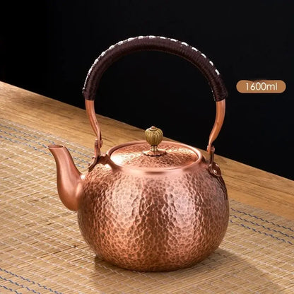 Handmade hammered copper tea pot with dark brown knitting handle and brass lid knob from decorbites handmade copper collection