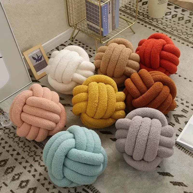 Handmade soft plush knotted boucle circle pillows in pastel and earthy tones for bedroom decor
