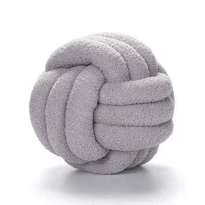 Handmade soft light gray knotted boucle circle plush pillow made of textured fleece for bedroom decor