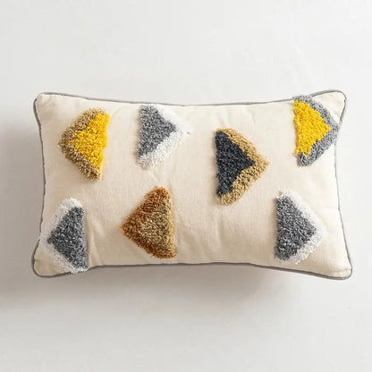 Cream-colored pillow cover with handmade moroccan geometric fuzzy triangular appliqués for living room decorbites decor