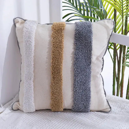 Cream-colored pillow cover with handmade Moroccan geometric design featuring three textured vertical fuzzy stripes decorbites