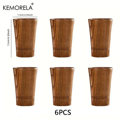 Set of six decorbites handmade natural wooden tea cups with warm brown finish and engraved geometric patterns near base