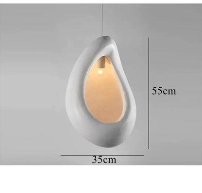 Handmade nordic designer white ceramic pendant light with teardrop shape and warm amber glow for dining room decor