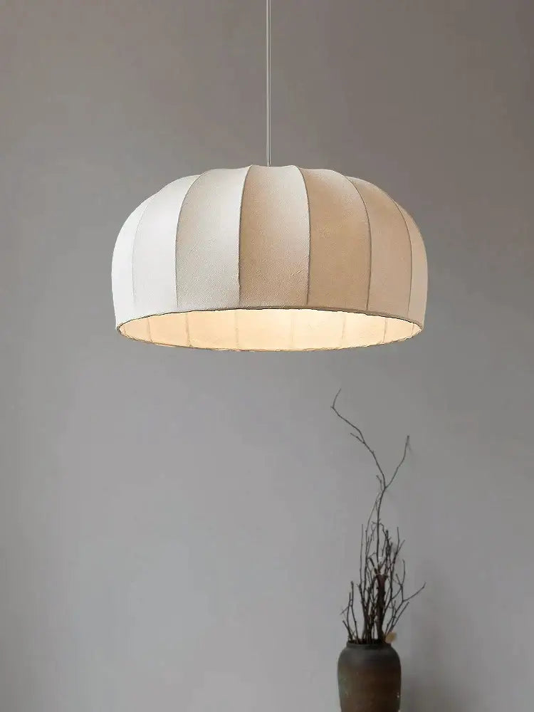 A soft dome-shaped silk pendant light with off-white and beige vertical stripes for dining room pendant lights