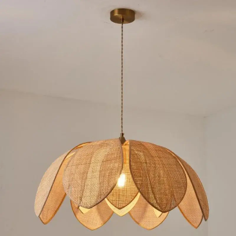 Handmade rattan petal pendant light by decorbites with warm tones shaped like a lotus flower for dining room decor