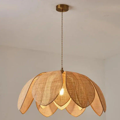 Handmade rattan petal pendant light by decorbites with warm tones shaped like a lotus flower for dining room decor