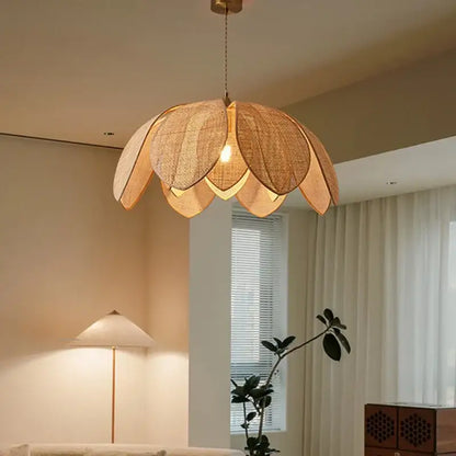 A warm-toned handmade rattan petal pendant light shaped like a lotus flower for dining room decorbites handmade rattan