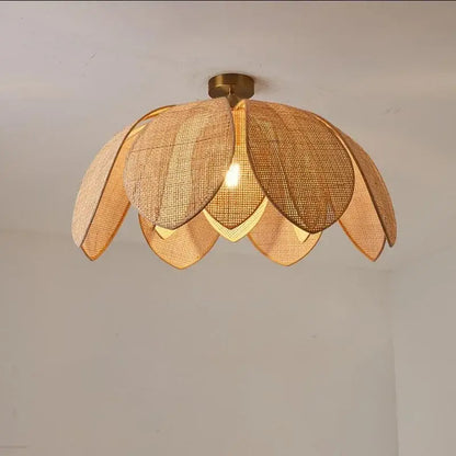Handmade rattan petal pendant light with warm-toned woven rattan and brass base for dining room decorbites handmade rattan