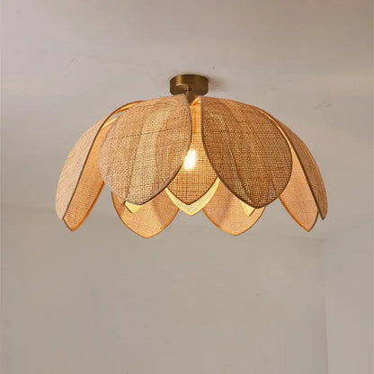Handmade rattan petal pendant light with warm-toned woven lotus design and brass finish by decorbites for dining room decor