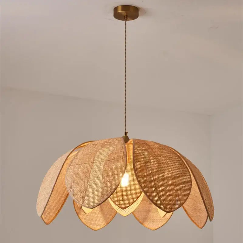 Handmade rattan petal pendant light with warm-toned woven rattan and brass ceiling mount for dining room decorbites pendant light