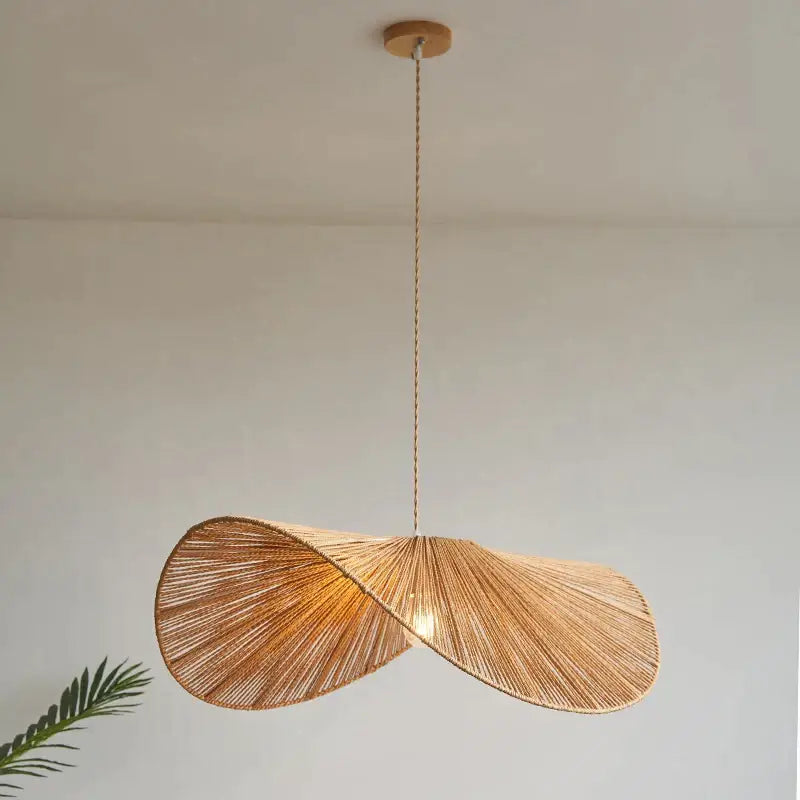 A warm-toned handmade rattan rope vertigo pendant lamp with woven twisted design for dining room decorbites handmade rattan