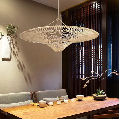 Beige handmade rattan wicker pendant light with wide fan design hanging in dining room decorbites wicker chandelier