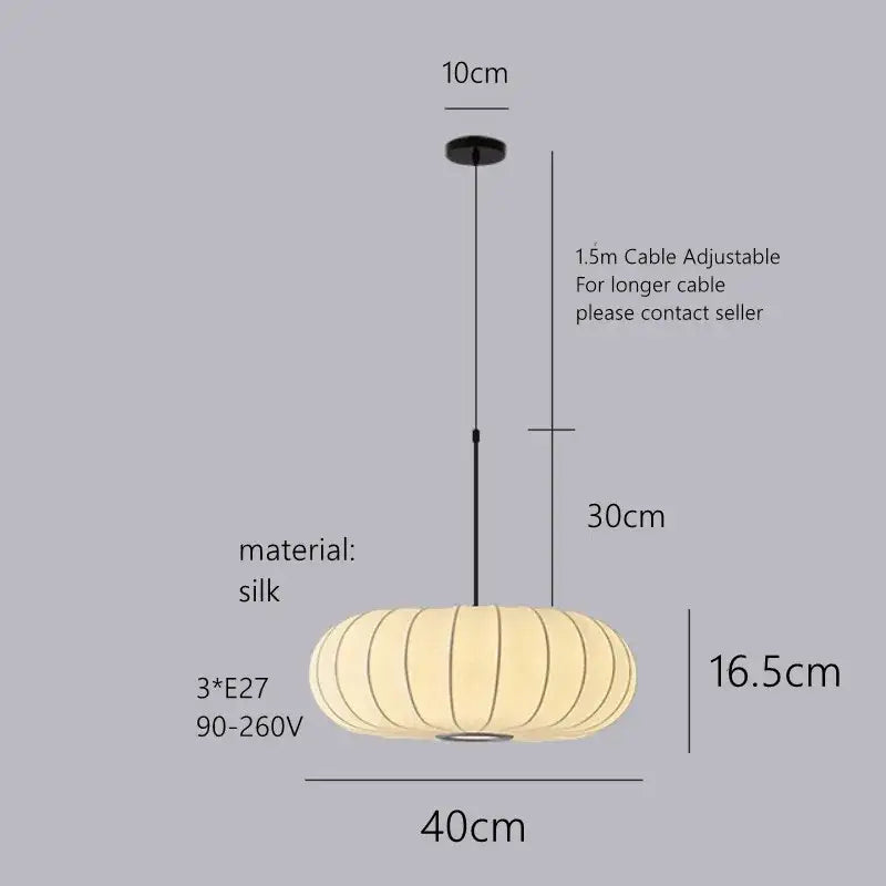 Cream-colored decorbites handmade silk pumpkin pendant light with segmented ribbed design and black hanging cable for dining room