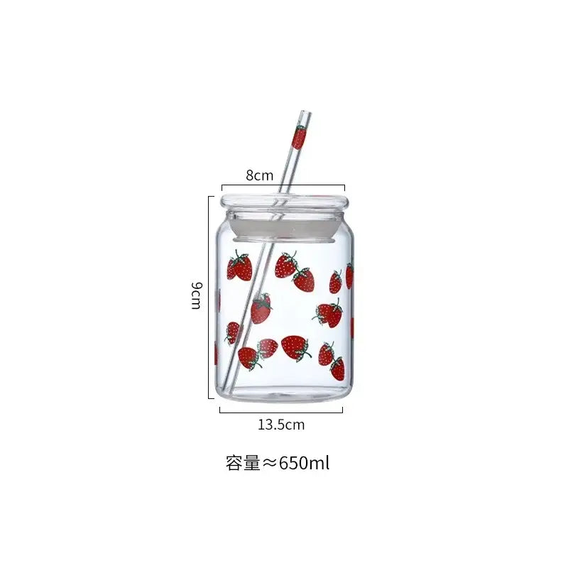 Handmade pink glass cup set featuring a clear glass cup with red strawberry decorbites and matching transparent lid and straw