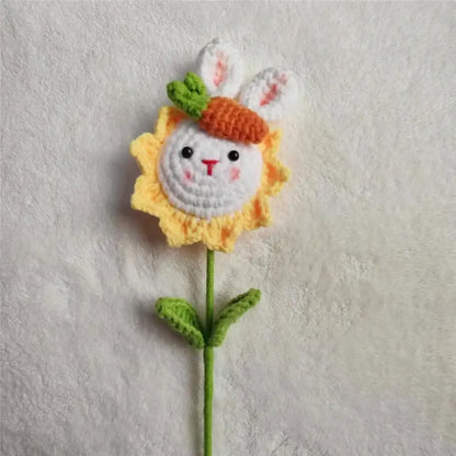 Handmade sunflower bouquet crochet ornament featuring a white bunny face with an orange carrot hat and green leaves