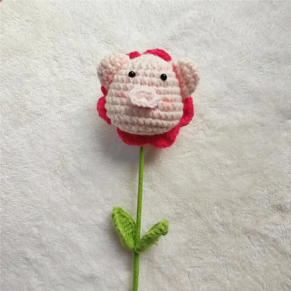 Handmade sunflower bouquet crochet bunny ornament featuring a pink pig-shaped flower with red crown and green stem