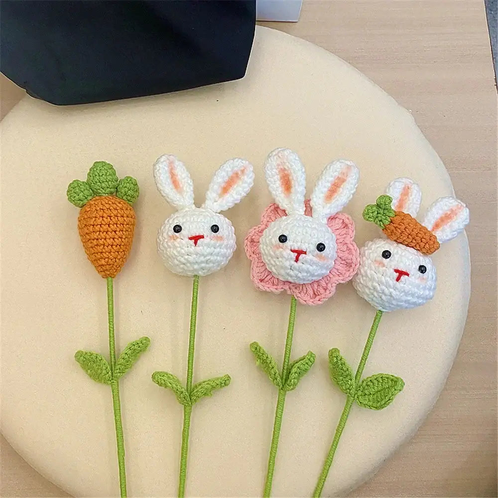 Handmade sunflower bouquet crochet bunny flower pins with white faces black eyes red noses and pink floral accents