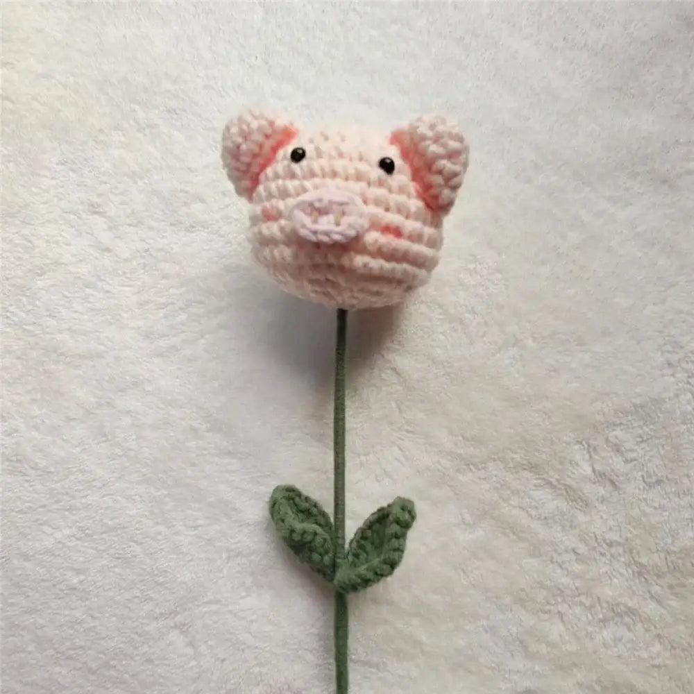 Handmade sunflower bouquet featuring a pink crocheted pig flower with green leaves for bedroom decor