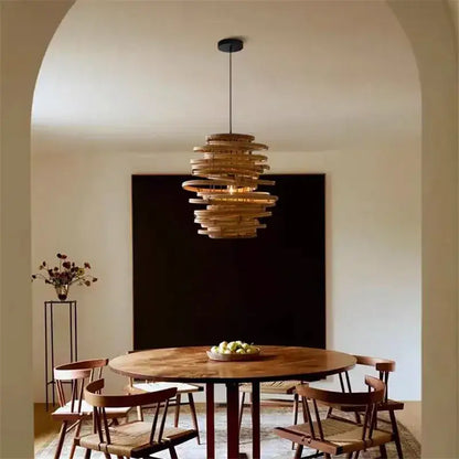 A warm-toned layered rattan decorbites bamboo birdnest pendant light with spiral design for bedroom decor