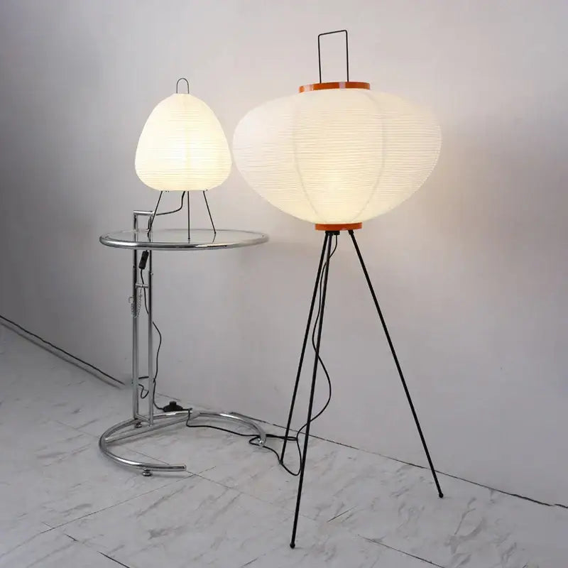 Handmade wabi sabi floor lamp with cream paper lantern, black tripod stand, and orange rim for living room decorbites decor