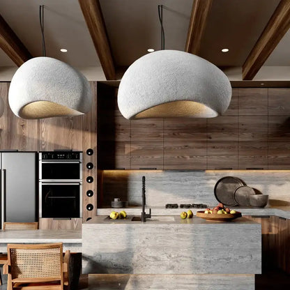 Two textured light gray dome-shaped decorbites handmade wabi sabi pendant lamps for dining room lighting are hanging