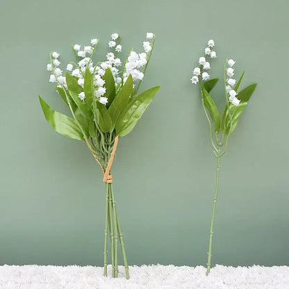 Handmade white bellflower artificial flowers bouquet with delicate blossoms and glossy leaves for wedding decor by decorbites
