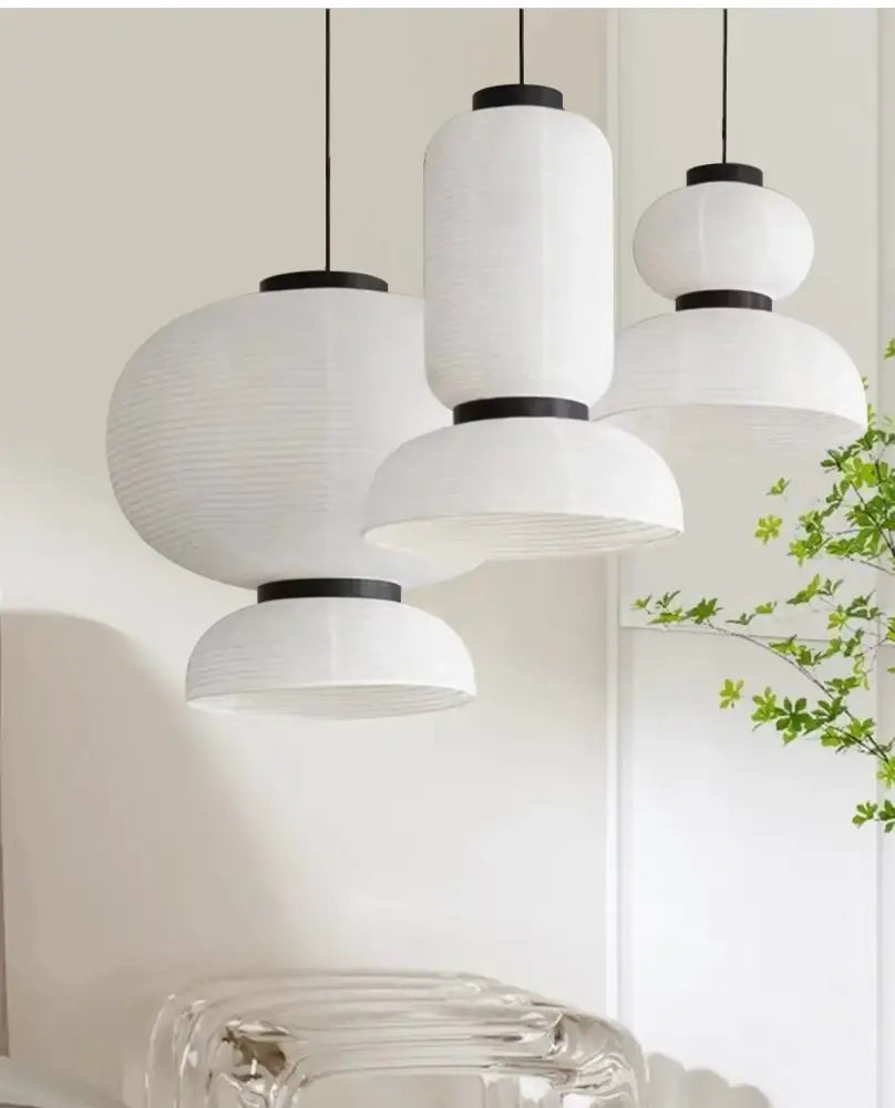 Handmade white paper chandelier with black metal accents for dining room decor by decorbites handmade white