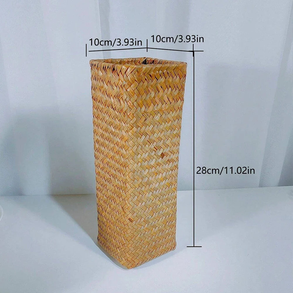 Handmade woven flower vase with tall cylindrical shape natural tan color and intricate herringbone pattern for home decoration