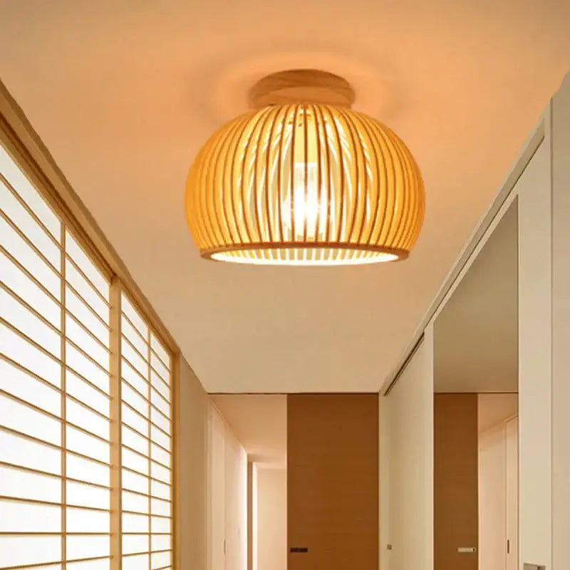 Warm-toned handwoven bamboo birdcage ceiling light with ribbed design ideal for dining room decorbites bamboo birdcage