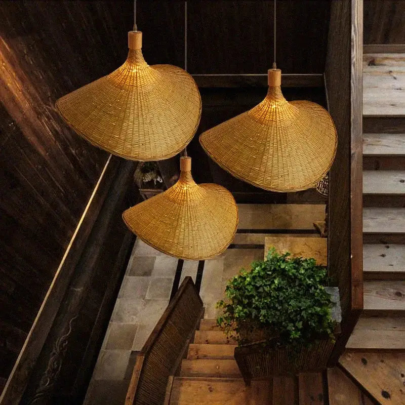 Three golden-brown handwoven bamboo pendant chandelier lights with traditional conical shape for living room decorbites bamboo pendant